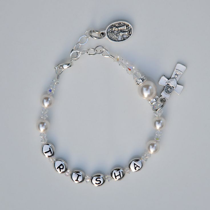 Personalized Custom Name First Holy Communion Swarovksi Sparkly White Crystal Pearl Rosary Bracelet Sterling Adjustable Sizing for Girls What girl wouldn't love to receive a beautiful Swarovski crystal pearl bracelet personalized with her own name to celebrate her First Holy Communion? The sterling silver extender chain allows the bracelet to grow with her, ensuring many years of wearability long after her special day. Each of the 6mm white crystal pearls represents a Hail Mary prayer. If you ch Silver Pearl Bracelet With Pearl Charm For Mother's Day, Adjustable Sterling Silver Beaded Bracelets With Pearl Charm, Adjustable Pearl Jewelry For Birthdays, Adjustable Pearl Jewelry For Birthday, Personalized Rosary Bracelet For Birthday And Mother's Day, Personalized Rosary Bracelet For Birthday, Adjustable Silver Name Bracelet With Birthstone, Personalized Adjustable Crystal Bracelet, Adjustable Personalized Crystal Bracelet