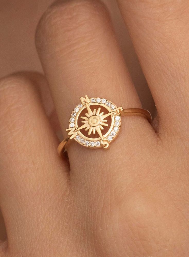 ★ 14K Solid Gold Compass Ring, 925 Sterling Silver Compass Ring, Direction Ring, Mother's Day Gift, Valentine's Day Gift, Christmas Gift★ ▷ MATERIAL ★ All of our 10K, 14K, 18K Jewelry are Solid Gold. ( Not Gold Filled or Gold Plated ) ★ All of our silver jewelry is 925 sterling silver and 14 carat gold plated. (Our white silver jewelry is rhodium plated.) ▷ PRODUCTION AND PACKAGING ★ Our jewelry is handmade. It is specially prepared for you in the dimensions you want upon order. ★ We work with three colors in our jewelry. Yellow, Rose, White ★ We prepare our jewelry by examining it to the smallest detail with our 21 years of experience. ★ Since we care about customer satisfaction and long-term relationship, we produce our jewelry considering daily use and natural wear. ★ If you wish, we ca Anniversary Jewelry Ring With Compass Design, Symbolic Rings With Compass Design For Gift, Symbolic Rings With Compass Design As Gift, Symbolic Compass Design Ring As Gift, Compass Design Ring Jewelry For Gift, Compass Design Jewelry Ring Gift, Compass Design Ring As A Gift, Sterling Silver Rings With Compass Design For Anniversary, Symbolic Round Diamond Ring For Gift