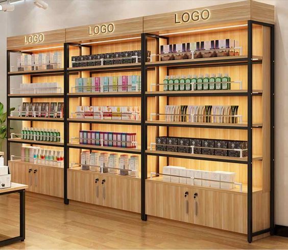 a store with wooden shelves filled with cosmetics and personal care items on display next to a plant