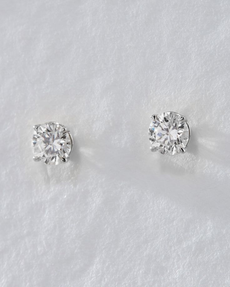 Our Ultimate Diamond Stud Earrings are a modern-take on the classic and timeless solitaire diamond studs. These stunning earrings feature a round-cut brilliant diamond with modern prong settings that are perfect for everyday wear. With a high shine finish and comfortable fit, they're the ideal choice for any lobe piercing. Available in 0.5ct and 1ct sizes for a luxe look. Minimalist Round Diamond Earrings For Formal Occasions, Minimalist Round Cut Diamond Earrings With Accents, Minimalist Solitaire Diamond Earrings, Minimalist Solitaire Cubic Zirconia Diamond Earrings, Minimalist Round Cut Brilliant Diamond Earrings, Minimalist Brilliant Cut Round Diamond Earrings, Minimalist Cubic Zirconia Solitaire Diamond Earrings, Classic Brilliant Cut Diamond White Earrings, Minimalist Round Cut Diamond Earrings