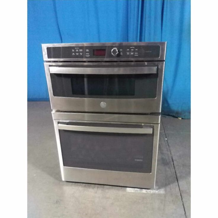 two ovens side by side on the floor