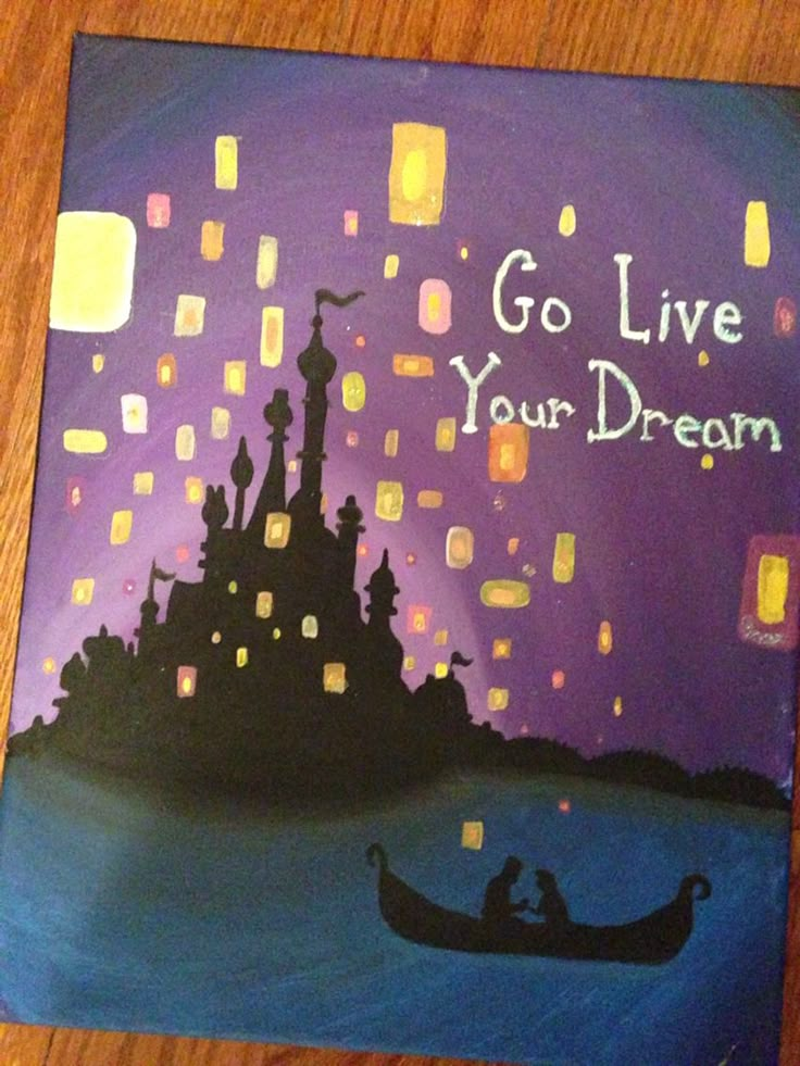 a painting on a wooden table that says go live your dream with a boat in the water