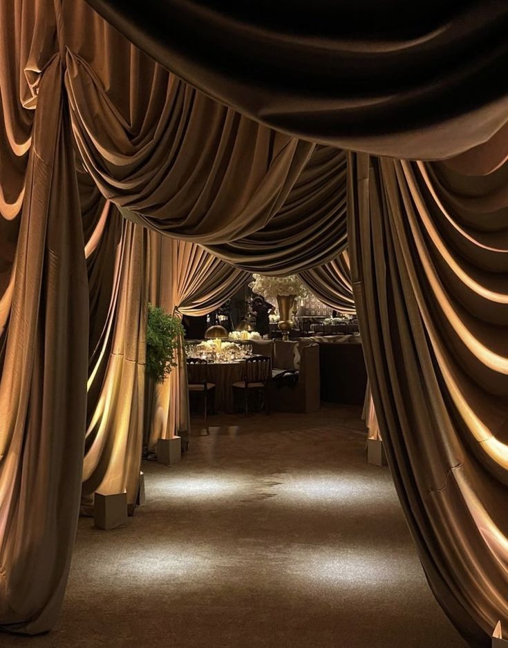 an image of a room that is decorated with drapes and lights on the ceiling