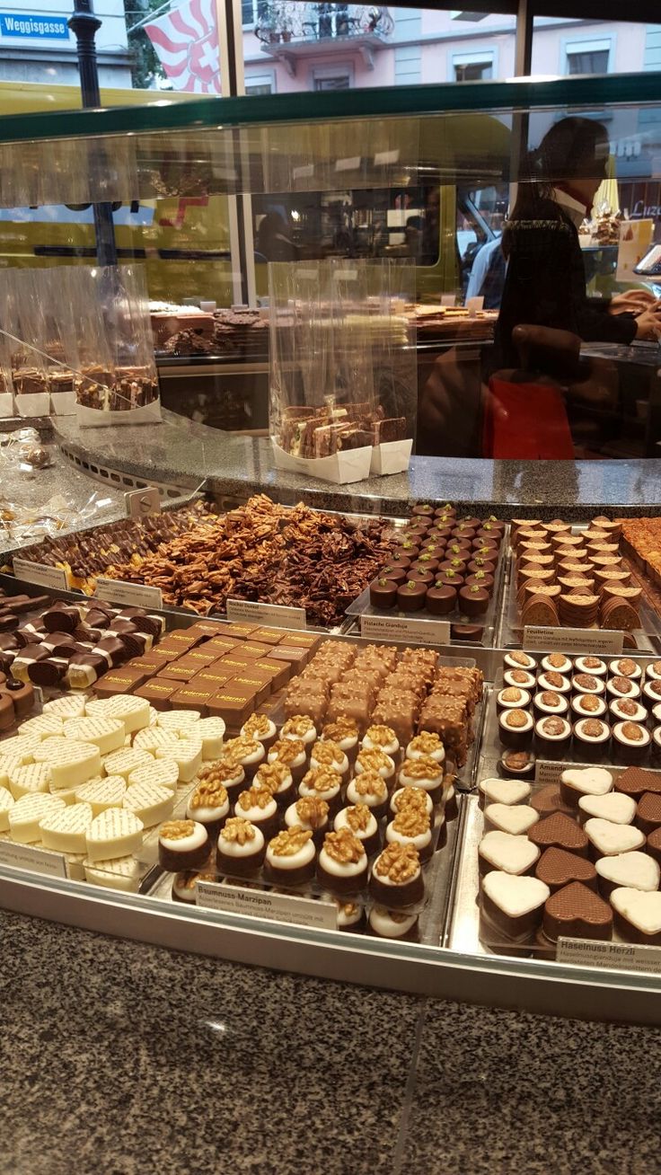 a display case filled with lots of different types of desserts