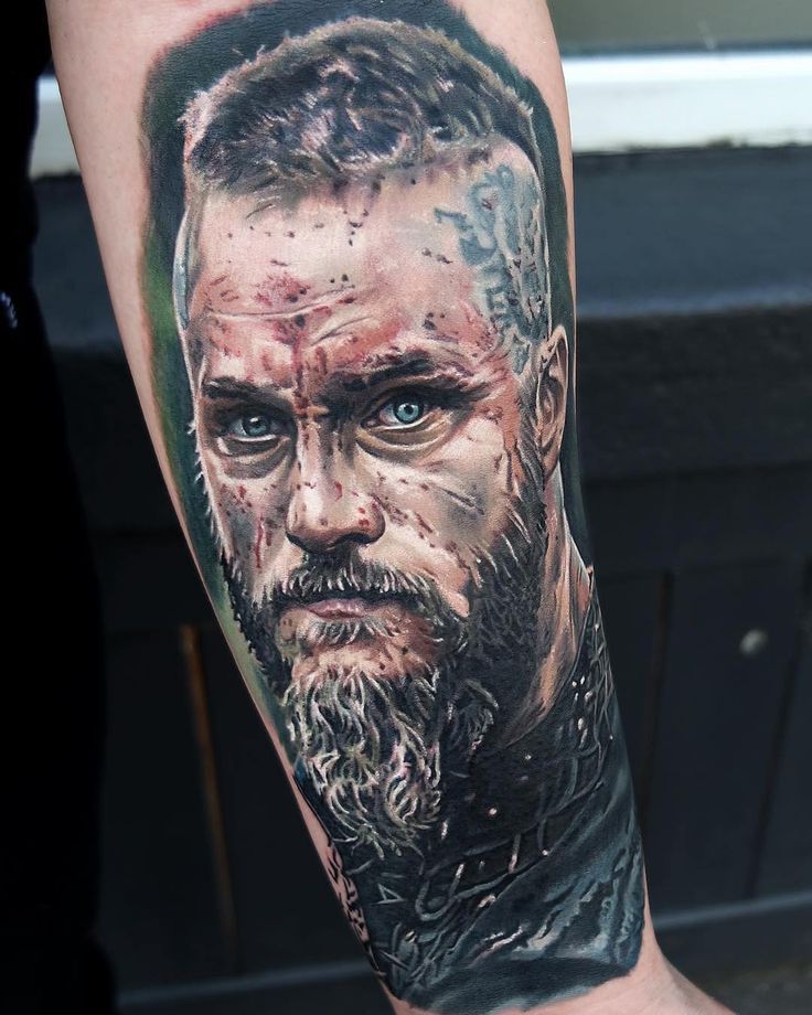 a man's arm with a portrait of abraham lincoln on it