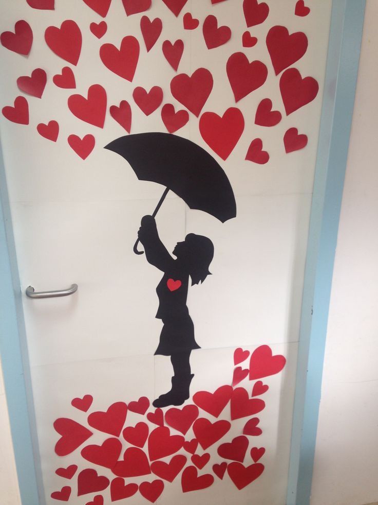 a door decorated with hearts and a silhouette of a girl holding an umbrella over her head