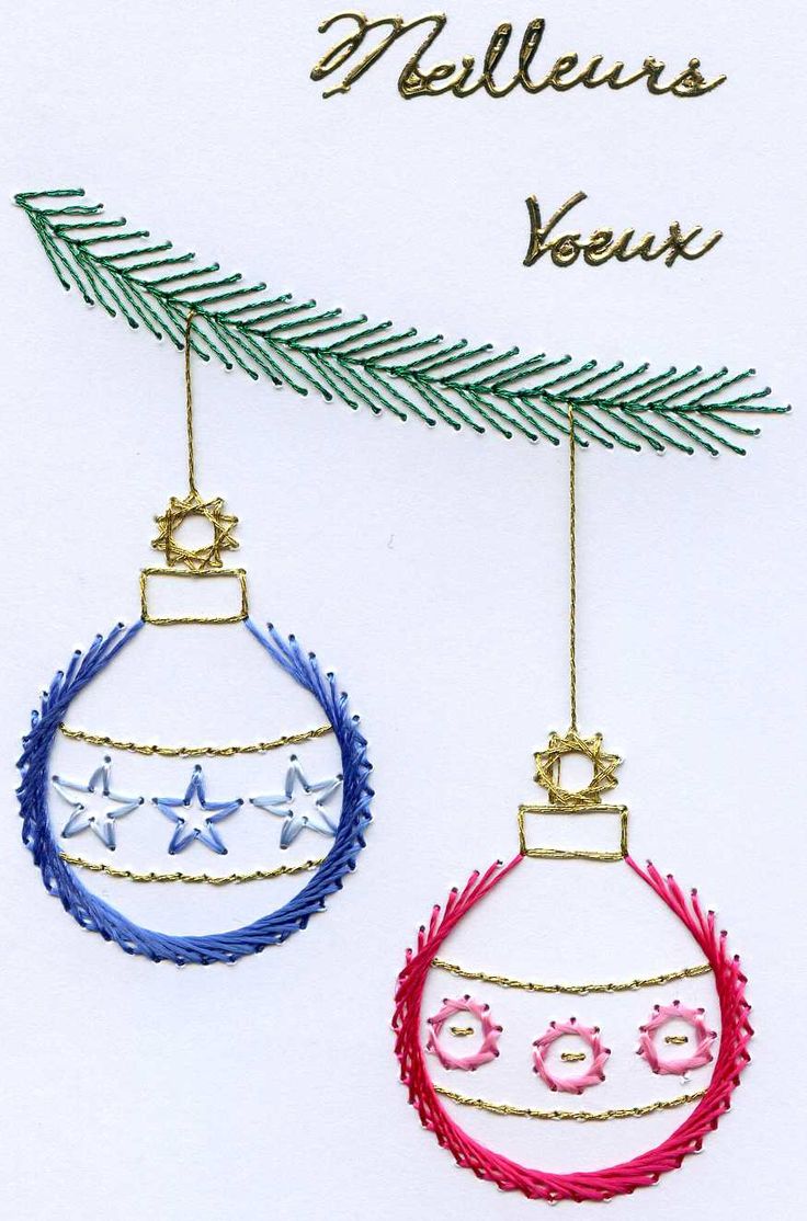 two ornaments hanging from a christmas tree with the words mellie's yeux on them