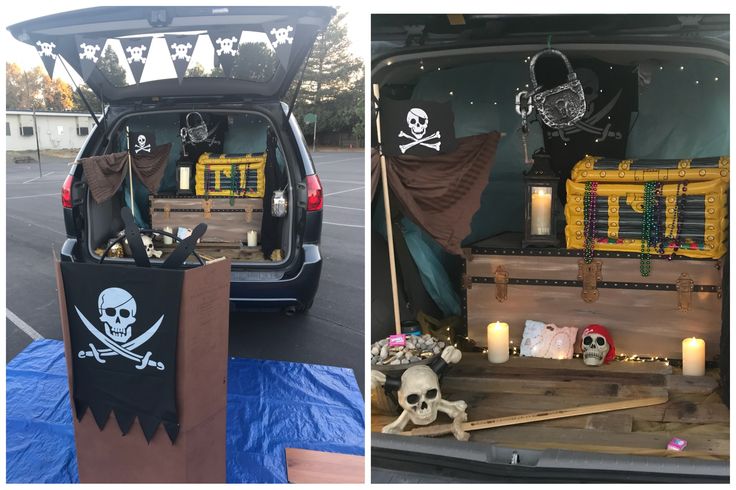 the back of a van with pirate decorations and candles in it's cargo area