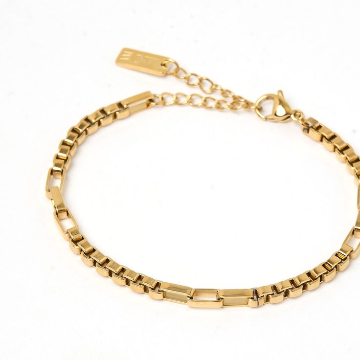 With a stunningly unique chain detail, the Juniper Bracelet is the classic bracelet that will make your look scream elegance and style! Layer with smooth cuffs or crushed metal to play with texture, the world is your oyster with Juniper!   14k Gold Plated (1 Micron Thick) Stainless Steel Base E-coating for a premium finish Lead & Nickel Free Measurements: 16cm chain + 4cm extension CARING FOR YOUR AOE JEWELS At Arms Of Eve, we take great pride in the quality of all our jewellery. All AOE pieces Timeless Gold Chain Metal Bracelet, Everyday Gold Metal Cuff Bracelet, Gold-tone Stainless Steel Bracelets, Gold-tone Stainless Steel Bracelets With Jubilee Bracelet, Timeless Metal Bracelets With Rectangular Links, Timeless Metal Bracelet With Rectangular Links, Trendy Stainless Steel Box Chain Bracelets, Gold-tone Stainless Steel Jubilee Bracelet, Trendy Stainless Steel Box Chain Bracelet