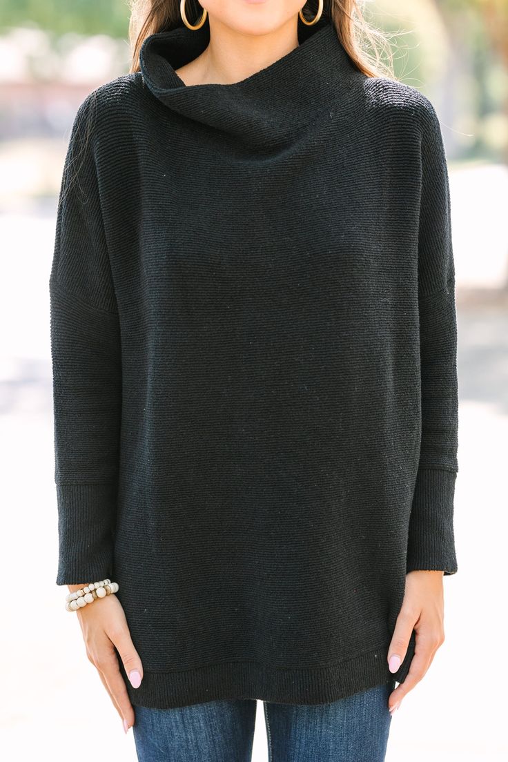 This wide mock neck tunic is the exact point at which style and comfort meet! The length is perfect for pairing with leggings which only adds to the comfort. We also love that you can dress this look up or down by pairing with boots/booties or sneakers depending on what your day looks like! Wide mock neckline Long sleeves with drop shoulders Ribbed fabric Oversized fit Fair stretch Sydney is wearing the small. Oversized Turtleneck For Layering, Black Mock Neck Top For Layering, Black Stretch Turtleneck With Funnel Neck, Black Turtleneck For Fall Layering, Versatile Mock Neck Top For Fall Layering, Black Mock Neck Top With Long Sleeves For Layering, Black Long Sleeve Mock Neck Top For Layering, Versatile Mock Neck Top For Layering, Black Turtleneck For Layering