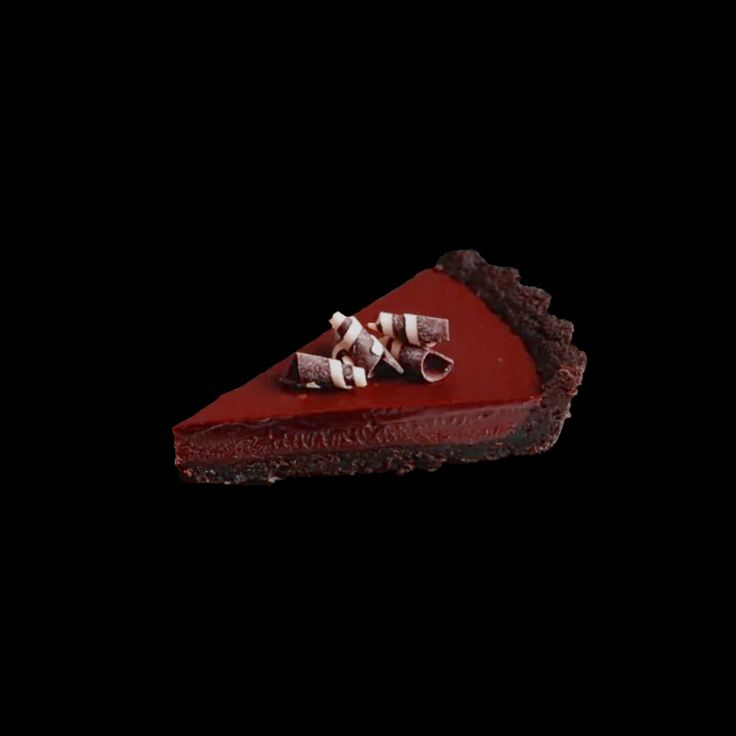 a slice of red velvet pie on a black background