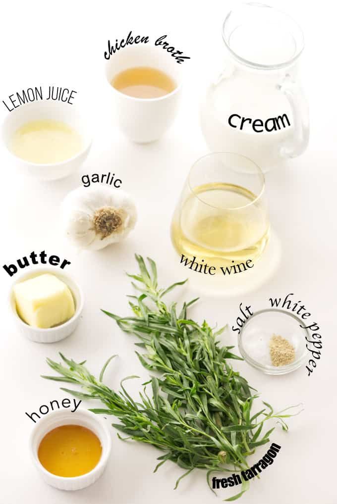 the ingredients needed to make an english tea recipe on a white surface with green leaves