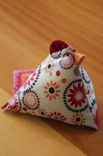 a small triangle shaped object sitting on top of a wooden table