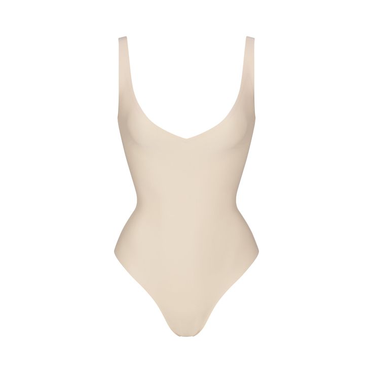 SKIMS BODY UNLINED PLUNGE THONG BODYSUIT | SAND Chic Solid Color Bodysuit With Built-in Bra, Chic Solid Bodysuit With Built-in Bra, Chic Seamless V-neck Bodysuit, Summer V-neck Shapewear With Built-in Bra, Summer Second-skin Shapewear, Fitted V-neck Shapewear For Summer, Summer Contoured Seamless Bodysuit, Sleek Summer Bodysuit With Lined Body, Sleek Summer Bodysuit With Moderate Back Coverage