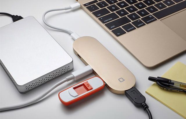 an open laptop computer sitting on top of a desk next to a mouse and pen