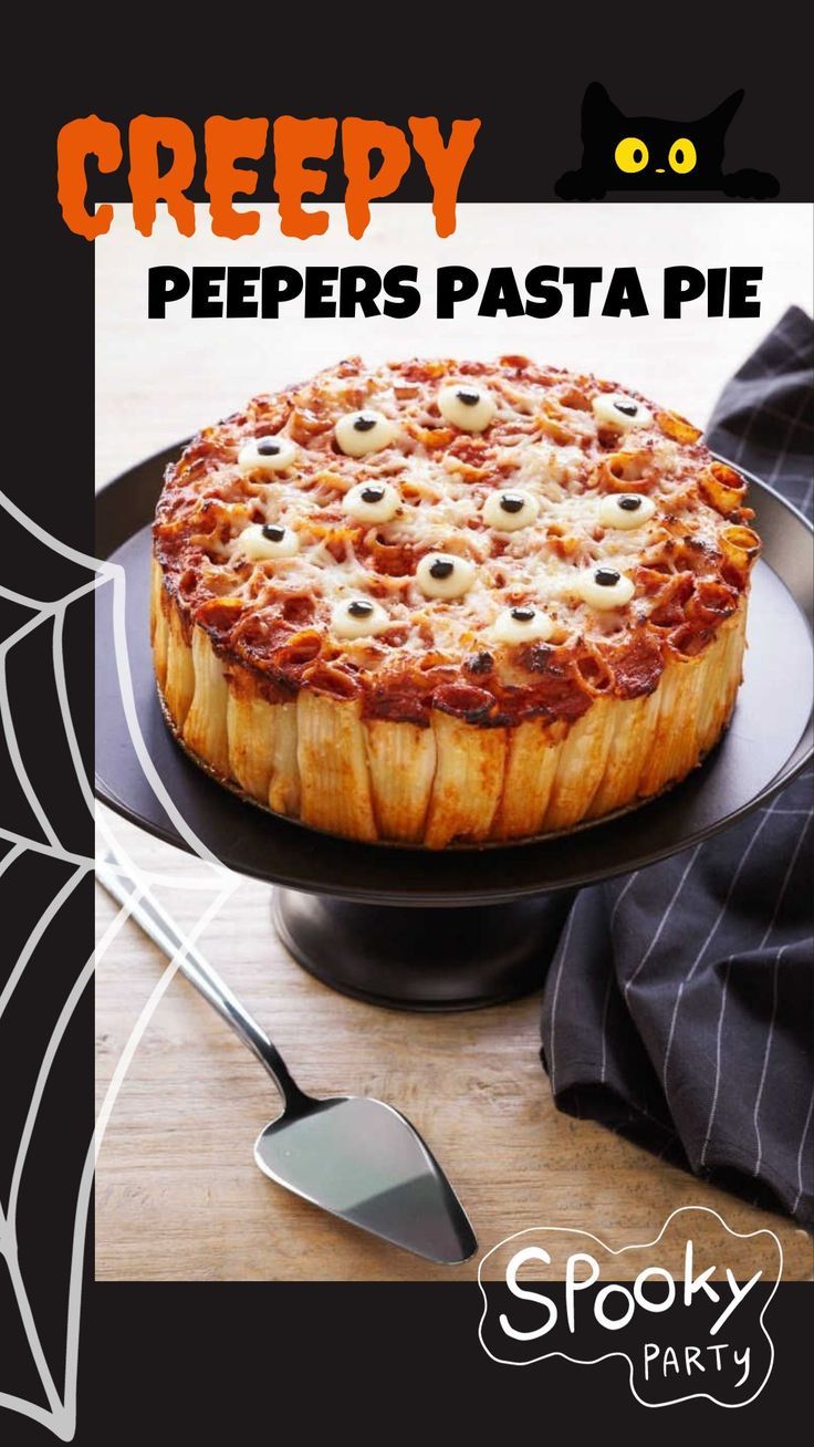 A picture of a Halloween dish with a title that says "creepy peepers pasta pie" around the photo are a black cat and spider webs. Halloween Foods For Kids, Spooky Pasta, Spooky Foods, Foods For Kids, Halloween Pasta, Pasta Pie, Halloween Foods, Fingerfood Party, Fun Halloween Food