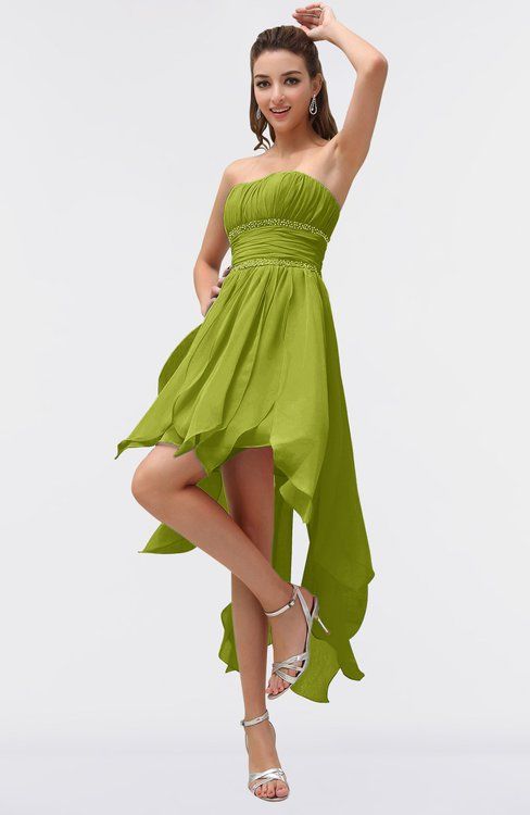 a woman in a green dress posing for the camera