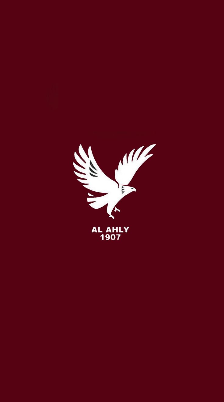 a white bird flying with the word al ahly in it's center on a red background