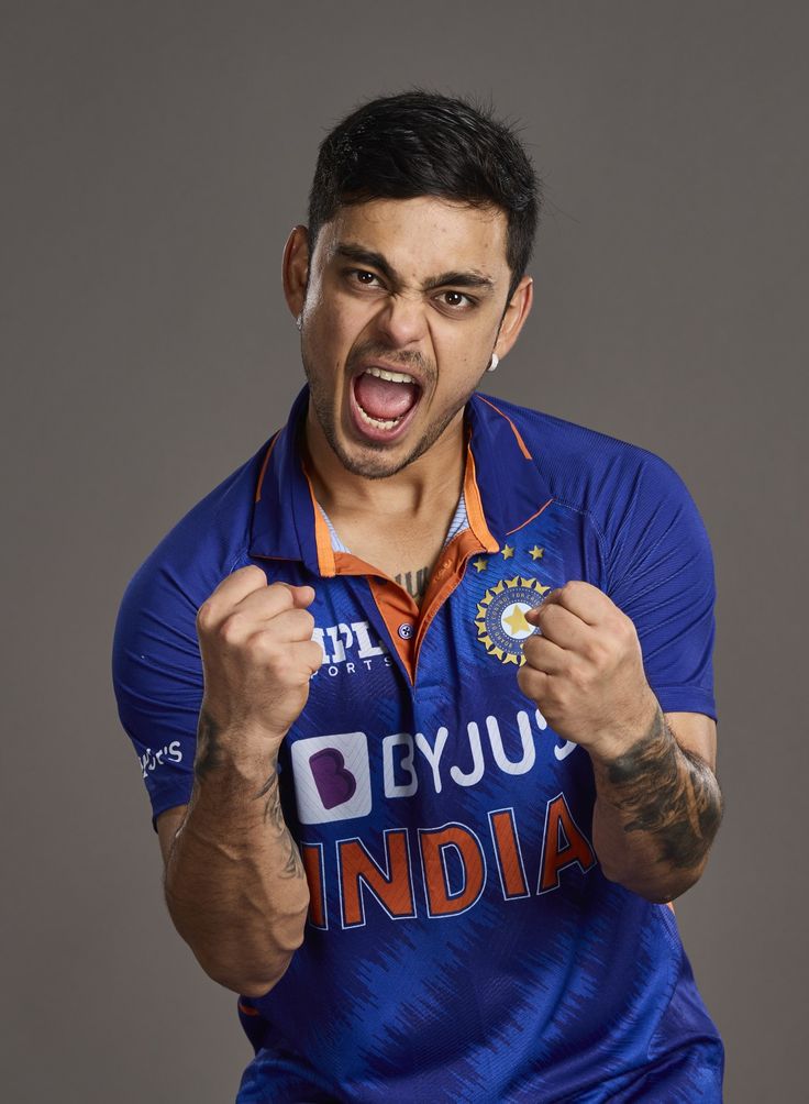 a man holding a badge in his right hand and making an angry face with his left hand