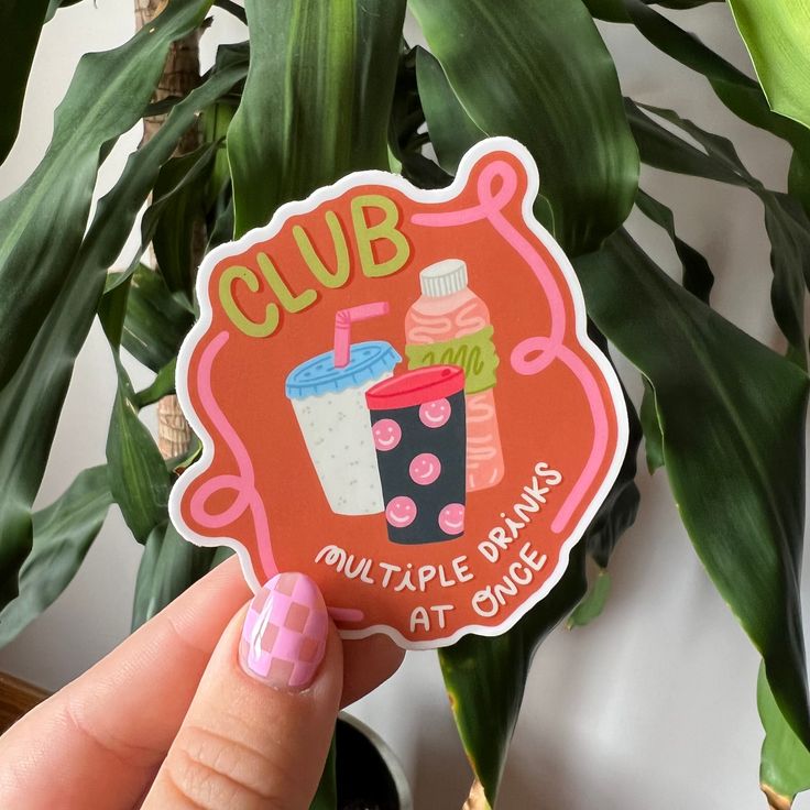 a person holding up a sticker that says club multiple drinks at choice on it