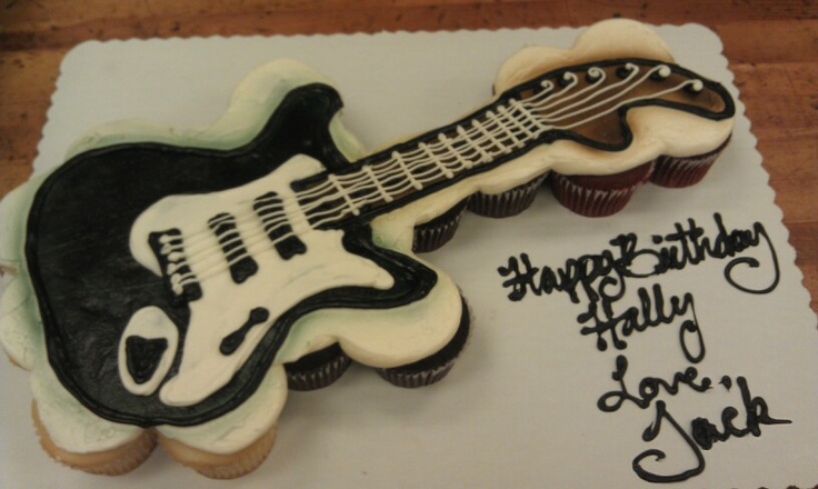 a birthday cake made to look like an electric guitar