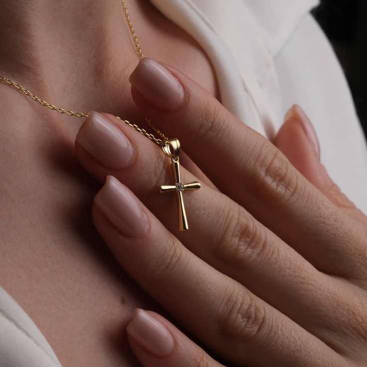 ⚠️ There is no customization on this necklace ⚠️ 💫 Welcome to our collection of elegant and meaningful jewelry, where simplicity meets spirituality. Our 14K Gold Minimalist Cross Necklace is a timeless piece that effortlessly blends faith and fashion. Crafted from the finest quality 14K gold, this delicate crucifix pendant exudes understated beauty and grace. ✨ Perfect for the modern woman who appreciates minimalist design, this necklace adds a touch of sophistication to any ensemble. The sleek Classic Cross Necklaces For Gifts, Minimalist Handmade Cross Jewelry, Handmade Cross Jewelry For Everyday, Classic Cross Necklace As A Gift, Cross Necklace With Charms As Gift, Tarnish Resistant Cross Pendant Necklace Gift, 14k Gold Cross Necklace For Gift, Cross Necklace With Charms For Gifts, Cross Charm Necklaces For Gifts