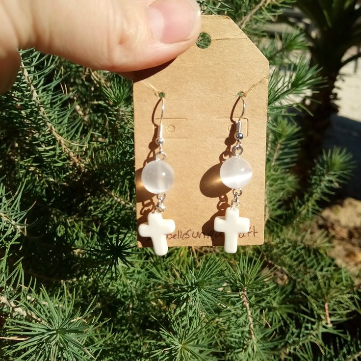 Unique handmade earrings personally made by myself. Selenite Crystal Earrings,  Cross earrings, religious earrings, Gemstone Earrings, Satin Spar Crystal Earrings, Crystal Jewelry. **READ BEFORE BUYING**  **BE CAREFUL WITH GETTING WATER ON THE SELENITE BEADS IT WILL MESS UP THE BEADS UP** ** I bought the crystal beads from a local Gem Show and everything in my shop is used with Nickle free silver** Earrings Cross, Unique Handmade Earrings, Angel Earrings, Gem Show, Earrings Gemstone, Selenite Crystal, Earrings Crystal, Cloth Bag, Cross Earrings