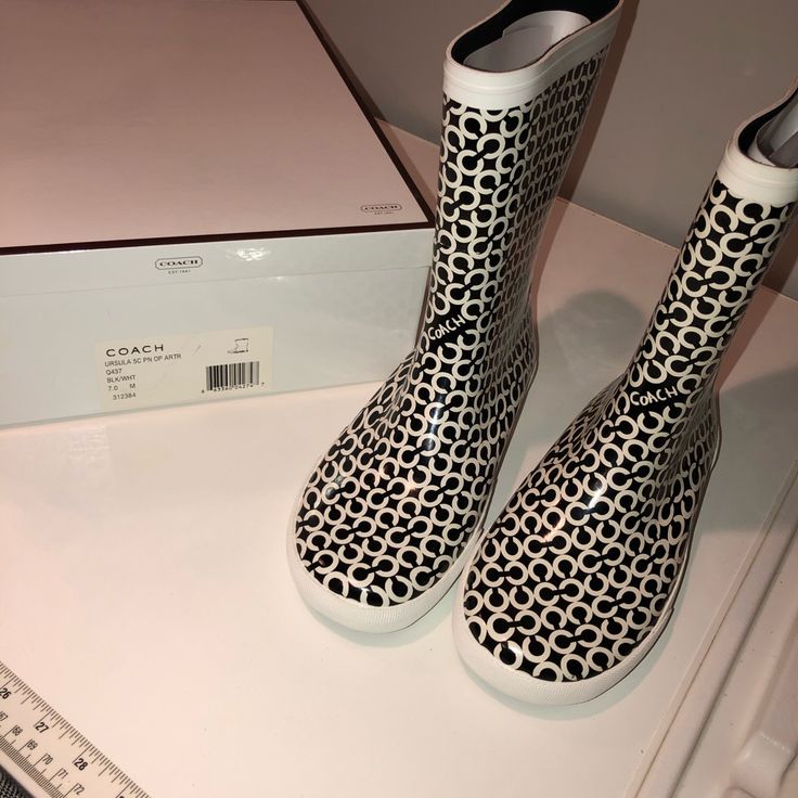 Black And White White Round Toe Rain Boots For Spring, White Waterproof Rain Boots For Spring, White Waterproof Boots For Spring, Waterproof White Boots For Spring, Casual White Waterproof Boots, Black Round Toe Rain Boots For Spring, White Sporty Boots For Spring, Trendy White Waterproof Boots, Coach Rain Boots