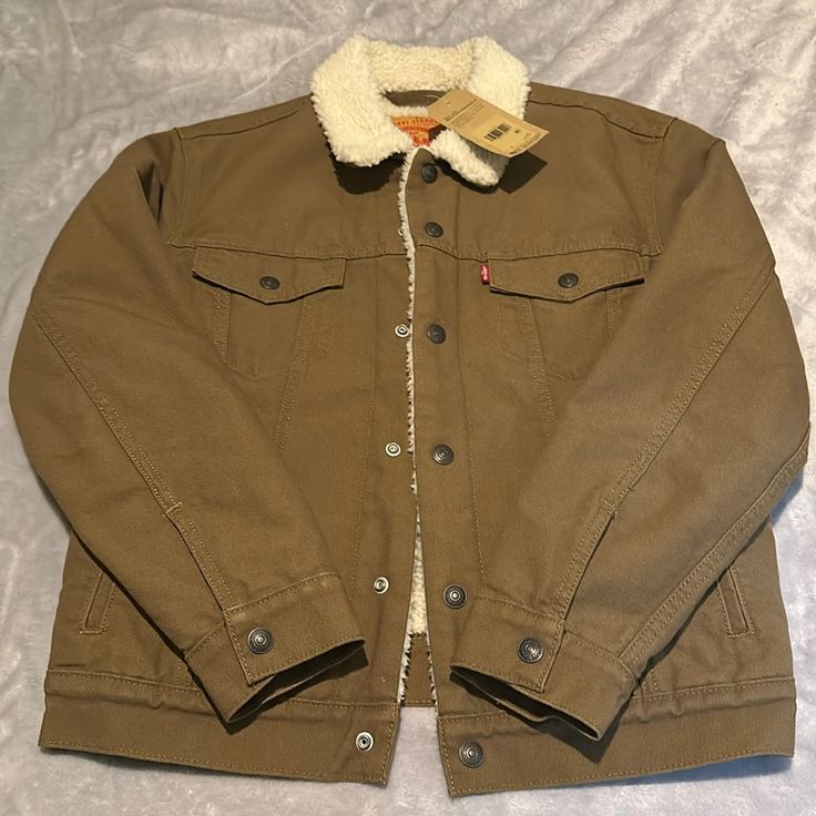 Nwt Levi’s Trucker Jacket Khaki Outerwear With Snap Buttons For Winter, Khaki Winter Outerwear With Snap Buttons, Winter Khaki Outerwear With Snap Buttons, Levi's Classic Outerwear With Button Closure, Classic Levi's Outerwear With Button Closure, Levi's Brown Winter Outerwear, Levi's Button-up Outerwear With Button Closure, Levi's Casual Outerwear With Button Closure, Spring Brown Outerwear With Fleece Lining