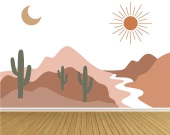 an empty room with wood flooring and desert scene