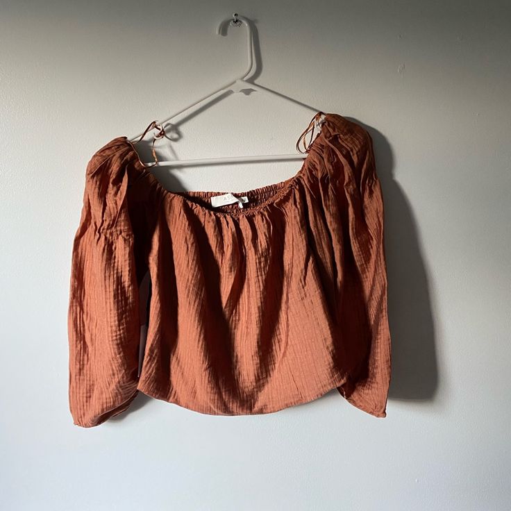 Brand: Astr The Label Color/ Brown/ Copper/ Rustic Shade Size: Medium/ M Style: Boho Cottage Cottage Core Puff Sleeve Blouse/Top With Ruching/Smocked Stretchy Back Very Cute/ Lightweight Summery Style Top- Just Didn’t Fit Me Right! Slightly Cropped But Doesn’t Look Cropped With High Waisted Pants In My Opinion New With Tags Lightweight Linen Like Material Cottagecore, Effortless Style, Revolve, Astr, Cropped Brown Long Sleeve Crop Top For Summer, Summer Brown Blouse For Brunch, Casual Brown Cropped Blouse, Fitted Brown Peasant Top Casual Style, Casual Fitted Brown Peasant Top, Fitted Brown Casual Peasant Top, Brown Puff Sleeve Blouse For Day Out, Fitted Brown Peasant Top For Spring, Brown Long Sleeve Peasant Top For Summer