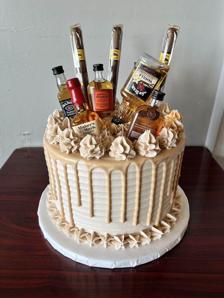 a cake decorated with liquor bottles and condiments