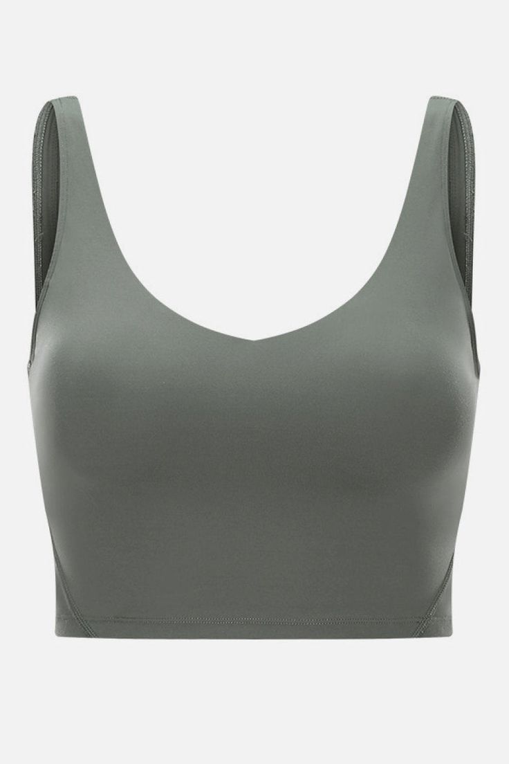 Scoop front and back tanks have long been popular in the fitness world. The simplicity of this bra is timeless and flattering on all body types. True to size Medium support Removable padding Scoop neck Material: 80% nylon, 20% spandex Care: Hand wash cold. Do not tumble dry. Imported Casual Activewear With Built-in Padding And Supportive Fit, Solid Activewear With Built-in Padding And Wide Straps, Solid Compression Tank Top With Built-in Padding, Scoop Neck Gym Tank Top With Built-in Padding, Sporty Scoop Neck Tank Top With Built-in Padding, Compressive Activewear With Wide Straps, Sports Bra With Built-in Padding And Scoop Neck, Scoop Neck Tank Top With Built-in Padding For Gym, Sporty Sports Bra For Pilates With Wide Straps