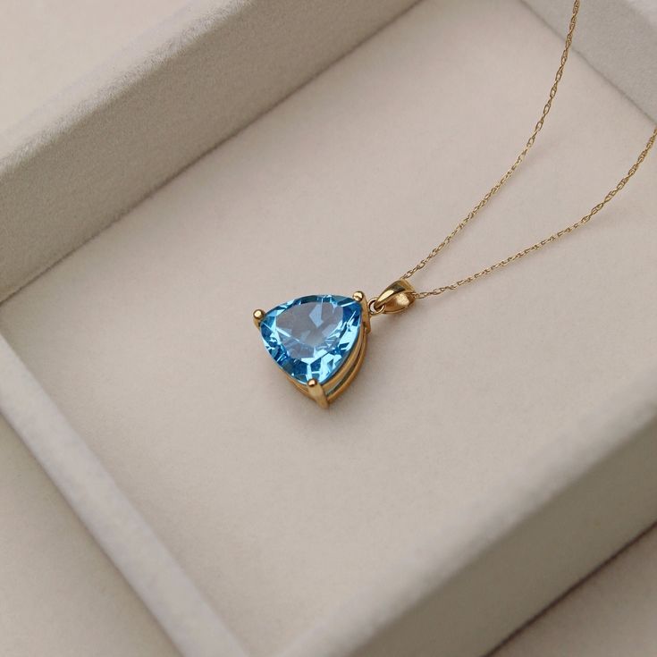 A T T R I B U T E S Vintage ∙ Solid Gold ∙ Estate Jewelry ∙ November Birthstone D E T A I L S ~ Vintage Necklace ~ 14K Yellow Gold ~ Sky Blue Topaz  ~ Trillion Cut aka fat triangle :) ~ Hallmarked ~ Gold Stamped ~ Velvet jewelry travel pouch and gift box included ~ Shipping, full insurance and signature confirmation included S P E C S Pendant Length: approx. 0.72" with bale Pendant Width (at widest point): 0.5" Shorter Necklace ~ Total Weight: 3.6g ~ Length: 18" chain Longer Necklace ~ Weight: 3 Yellow Gold Topaz Gemstones As Gift, Sapphire Gemstones Fine Jewelry Gift, Sapphire Gemstones For Gifts, Fine Jewelry, Blue Topaz Gemstones With Gemstone Accents For Gift, Classic Topaz Gemstones As A Gift, Classic Blue Topaz Necklace For Gift, Luxury Trillion Cut Jewelry For Gifts, Blue Topaz Gemstones For Gifts, Luxury Trillion Cut Jewelry Gift