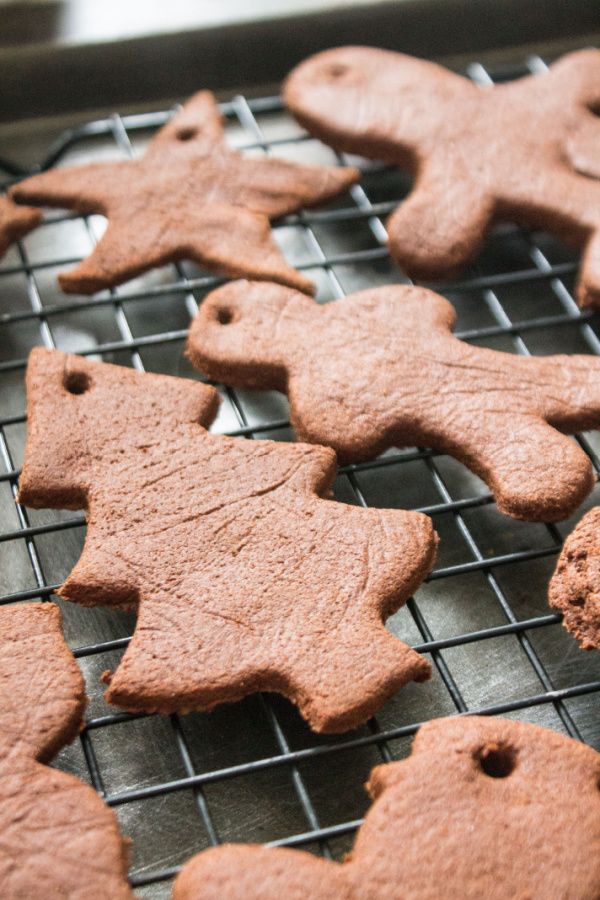 some cookies are cooling on a rack and ready to be baked in the oven for christmas