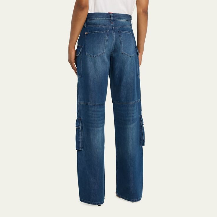 Alice + Olivia "Cay" baggy cargo pants in dark wash denim Approx. 10" rise; 34.5" inseam Five-pocket style Mid rise sits high on hip Functional leg cargo pockets Full length Wide legs Button/zip fly; belt loops  Cotton/lyocell Lining: Cotton Dry clean Imported Denim Cargo Pants With Belt Loops In Dark Wash, Denim Cargo Pants With Dark Wash, Dark Wash Cargo Style Flare Jeans For Streetwear, Urban Dark Wash Cargo Jeans With Belt Loops, Urban High-rise Cargo Style Jeans, Urban High-rise Cargo Jeans, Utility Cargo Jeans With Belt Loops In Medium Wash, Dark Wash Straight Leg Cargo Jeans With Belt Loops, Urban Dark Wash Jeans With Cargo Pockets