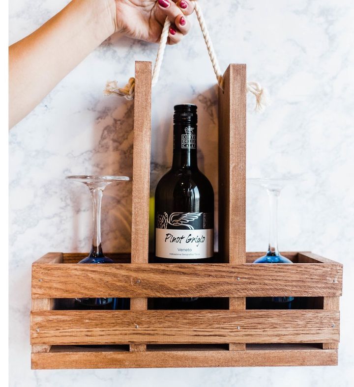 a bottle of wine in a wooden crate