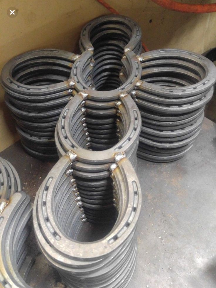 several coils and springs are stacked on top of each other in an industrial area