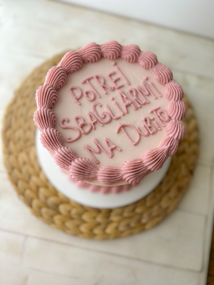 a white cake with pink frosting that says pre - sedulat birthday on it