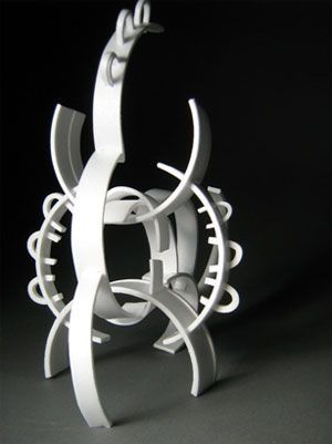 a white sculpture sitting on top of a table