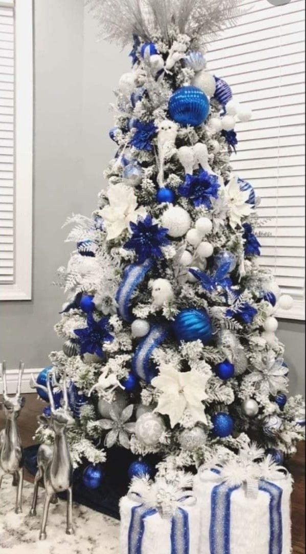 a blue and white christmas tree decorated with ornaments