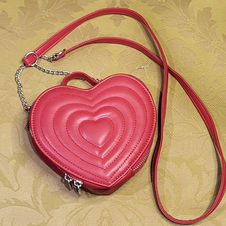 Adorable Heart Shaped Bag New Without Tags. Just Isnt Quite Big Enough For Me. Cute Red Bags For Gifts, Cute Red Bag For Gift, Trendy Red Shoulder Bag For Valentine's Day, Trendy Red Heart-shaped Bag, Heart-shaped Shopping Bags, Valentine's Day Heart-shaped Shoulder Bag, Cute Heart Print Bag For Valentine's Day, Valentine's Day Red Shoulder Bag With Adjustable Strap, Red Shoulder Bag With Adjustable Strap For Valentine's Day