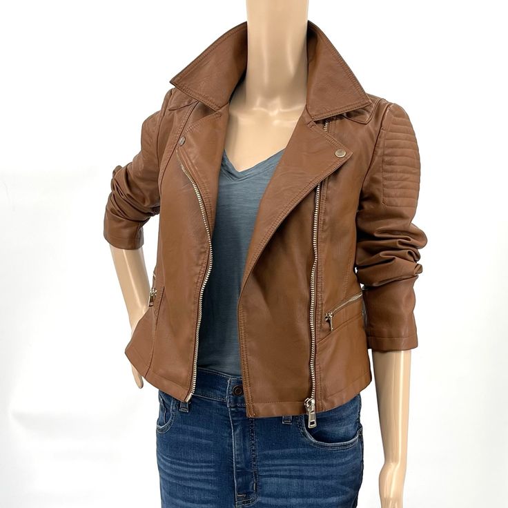 A Faux Leather Moto Jacket Featuring Ribbed Seam Detail, Buttoned Flat Collar, Zip-Up Front Closure, Zippered Slanted Front Pockets, Long Sleeves With Zippered Sleeves. Fully Lined. Length 20.5”, Chest Ptp 18”- Excellent New Condition With Tags. Trendy Fitted Faux Leather Outerwear, Fitted Faux Leather Outerwear For Spring, Casual Faux Leather Biker Jacket For Spring, Fitted Faux Leather Biker Jacket For Spring, Fitted Moto Outerwear For Fall, Fitted Faux Leather Moto Outerwear, Fitted Moto Outerwear In Faux Leather, Spring Biker Faux Leather Outerwear, Moto Style Faux Leather Outerwear For Fall