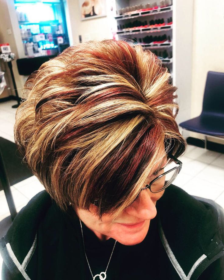 By Tierney Allen  Instagram: @tierneys_stylingchair   #hair #highlights #salonlife #shorthairstyles #shorthair #hairstyles #haircolor #haircuts Short Hair Highlights And Lowlights Pixie, Short Hair Highlights And Lowlights Older Women, Short Red Hair With Highlights, Fall Hair Colors For Short Hair Pixie, Fall Hair Colors For Short Hair, Short Red Hair With Blonde Highlights, Hair With Chunky Highlights, Red Hair With Silver Highlights, Short Hair Color Highlights