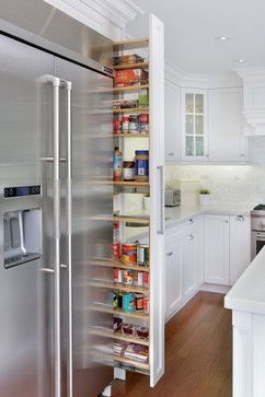 an organized pantry in the middle of a kitchen