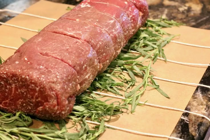 a piece of meat sitting on top of a grill