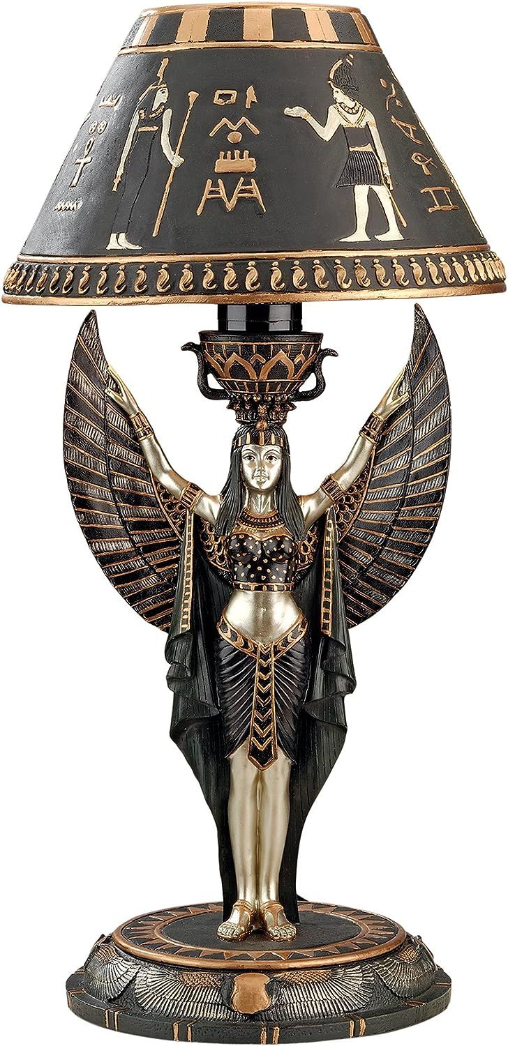 an egyptian style lamp with gold and black accents