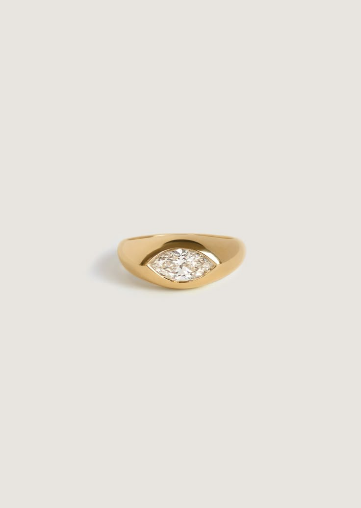 A bold piece with a flush burnish set marquise diamond—The Eloise is a vintage-inspired take on our best selling signet style. 14k solid gold—always Band width: 8mm (front), 2.5mm (back) Height off of finger: 3.4mm Natural diamond 4C’s: 1cw, Marquise, VS1-2, G Lab diamond 4C’s: 1cw, Marquise, VVS2-VS1, DEF Custom sizing is available. Custom sized pieces are final sale This piece cannot be resized This piece is made to order. Please allow at least 3-4 weeks for production. Our engagement rings ar Diamond 4c, Thick Engagement Rings, Signet Engagement Rings, Unconventional Engagement Rings, Hand Ornaments, Silver Pearl Jewelry, Fall Rings, Diamond Signet Ring, Engagement Ring Inspiration