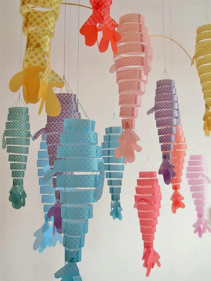 an instagram photo of some seahorses hanging from the ceiling with pins on them