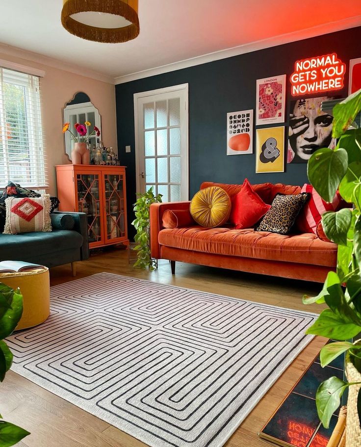 a living room filled with furniture and plants